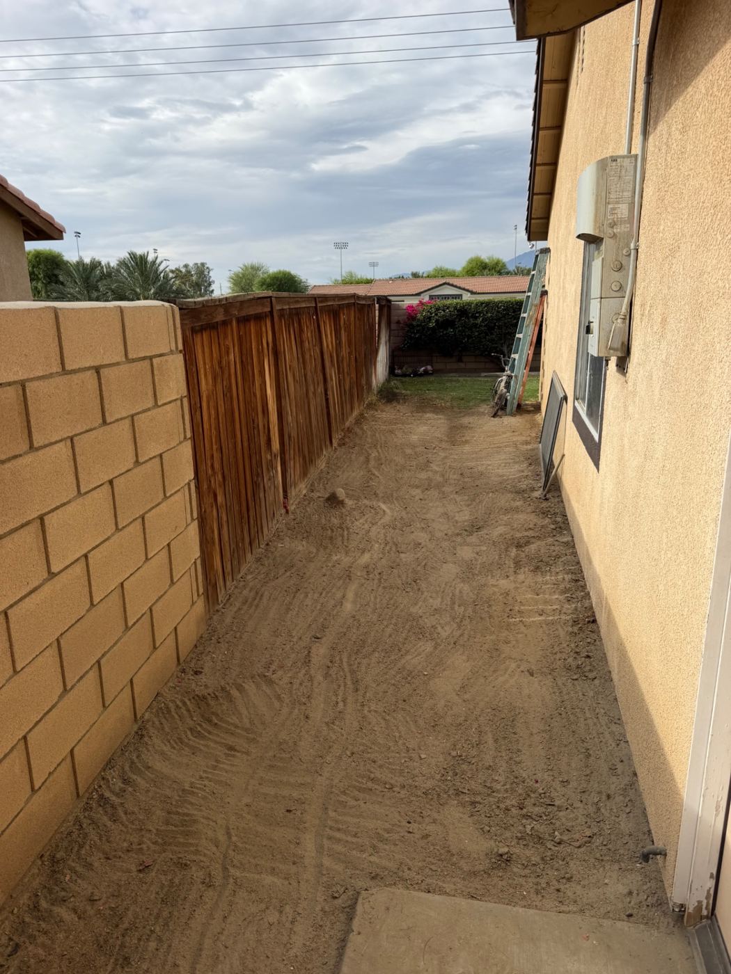 Side yard completely cleared of junk after HG Junk Removal service
