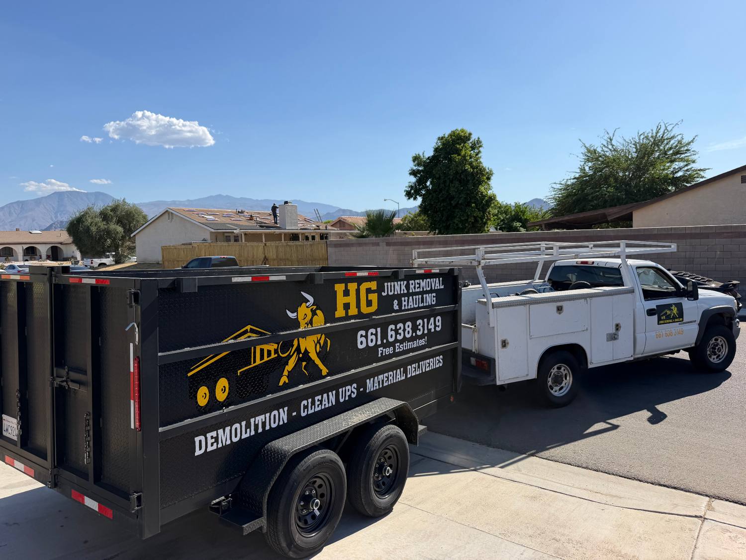 HG Junk Removal & Hauling truck and dump trailer on a job site